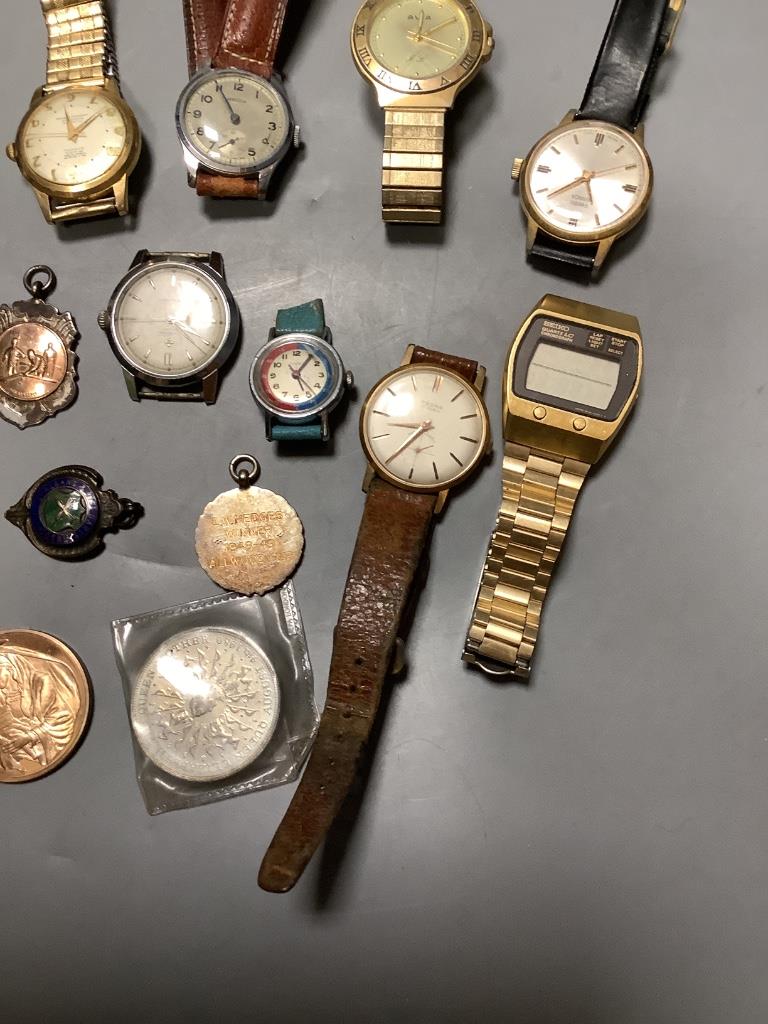 Eight assorted wrist watches including Cortebert and minor coins and medallions.